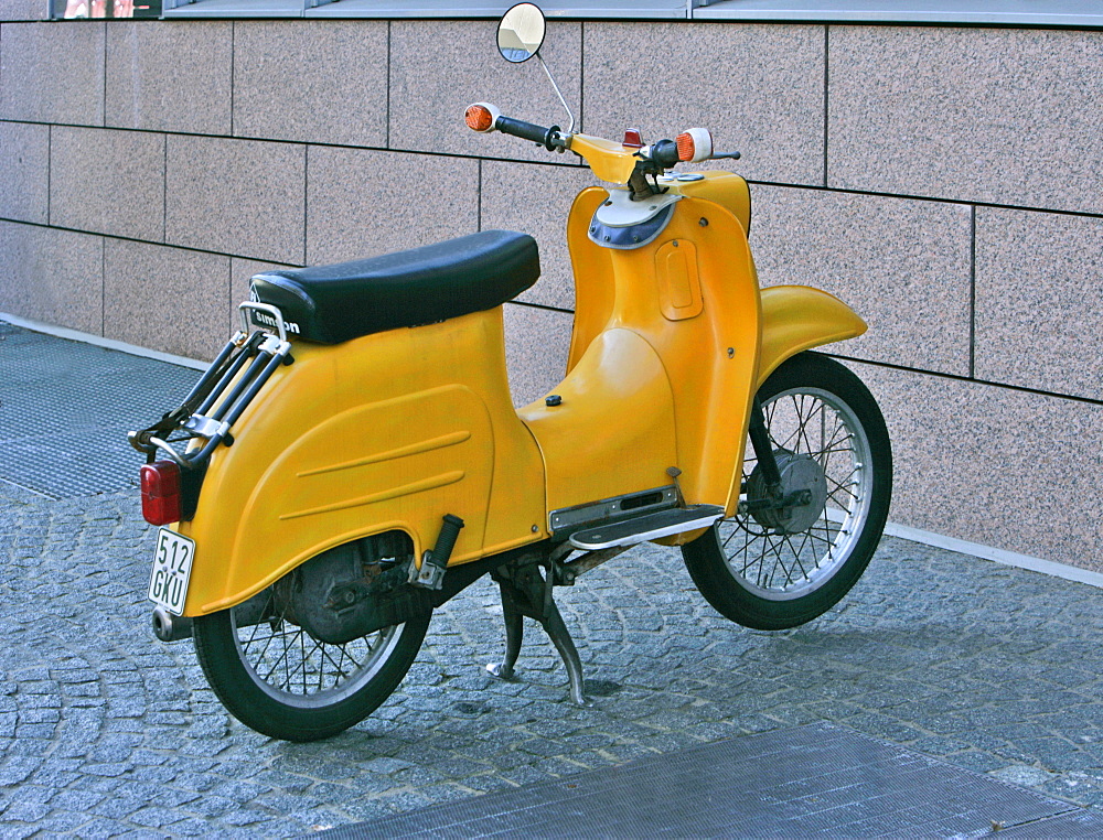 Yellow motor-scooter