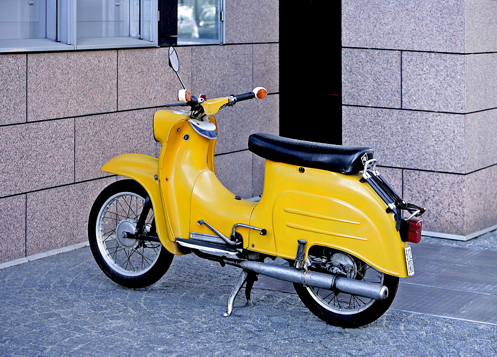 Yellow motor-scooter