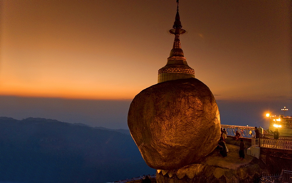 Golden rock and stupa at sunset, Kyaikhtiyo, Myanmar (Burma), Southeast Asia