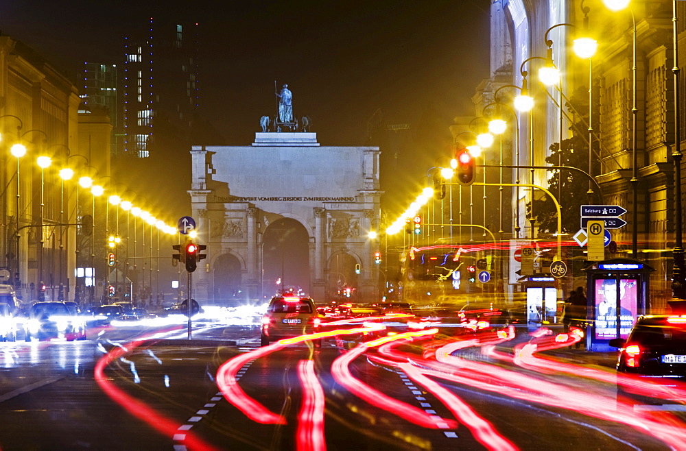 View over Ludwigstrasse towards Siegestor at night Munich Bavaria Germany