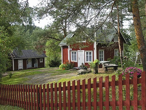 Traditional red wooden country house Kannuskoski near Kouvola, Finland