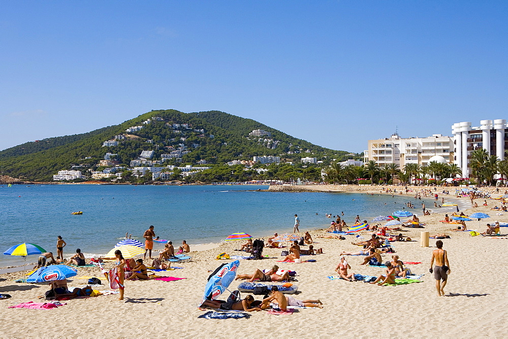 Tourists on the beach of Santa Eularia des Riu, Ibiza, Balearic Islands, Spain, Europe