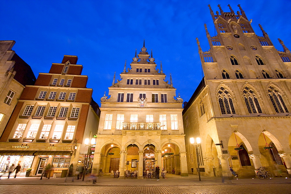 Lit-up city hall and Stadtweinhaus or City Wine House at Prinzipalmarkt, Muenster, North Rhine-Westphalia, Germany, Europe