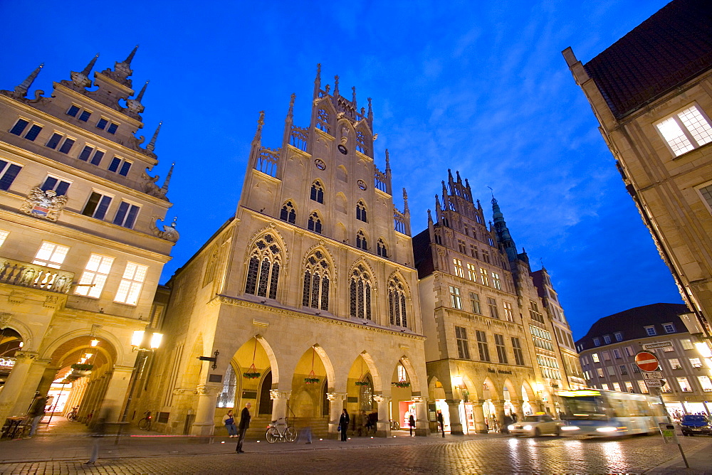 Lit-up city hall and Stadtweinhaus or City Wine House at Prinzipalmarkt, Muenster, North Rhine-Westphalia, Germany, Europe