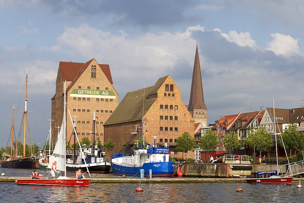 St. Peter's Church and warehouses on the Warnow River, Rostock, Mecklenburg-Western Pomerania, Germany, Europe