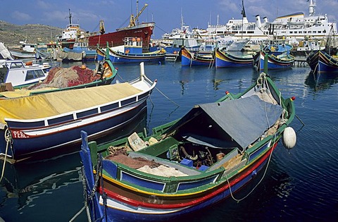 Luzzu boats in the harbour of Mgarr, Gozo island, Malta