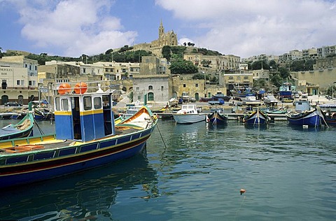 Luzzu boats in the harbour of Mgarr, Gozo island, Malta