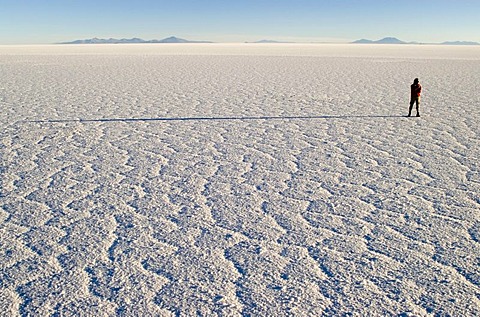 Person standing on Salar de Uyuni, Bolivia