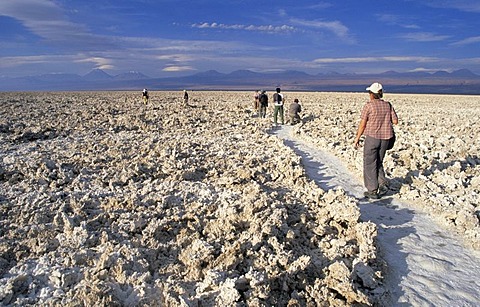 Tourists hiking on Salar de Atacama, Atacama Desert, Chile