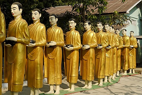 Statues of monks in a monastery, Yangon, Myanmar