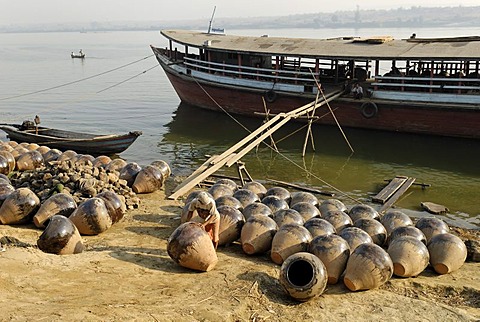 Boat on the banks of Irrawaddy river with Martarban pots, Kyauk Myaung, Myanmar