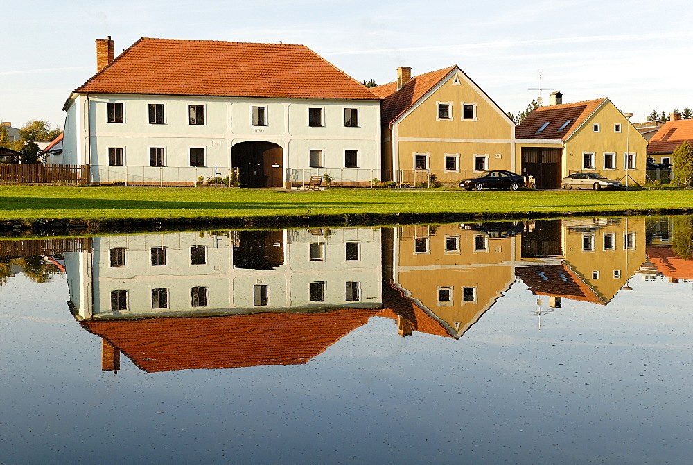 Village square with fire pond of Zabori, south Bohemia, Czech Republic