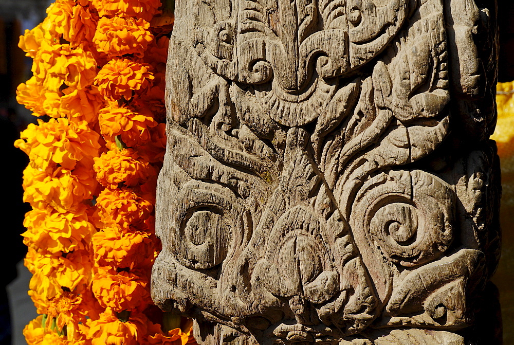 Carved wooden coloumn with flower decoration, Patan, Kathmandu, Nepal