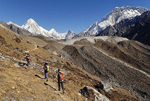 Trekking group on Khumbu glacier with Nuptse (7861), Khumbu Himal, Sagarmatha National Park, Nepal