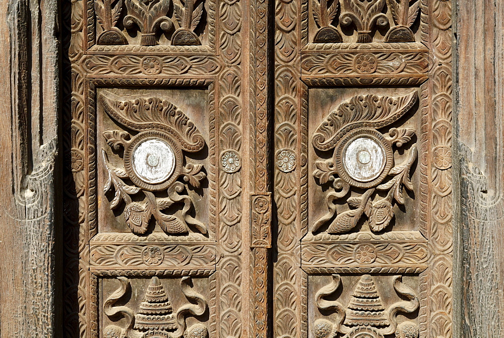 Carved wooden door in the old town of Bhaktapur, Kathmandu valley, Nepal