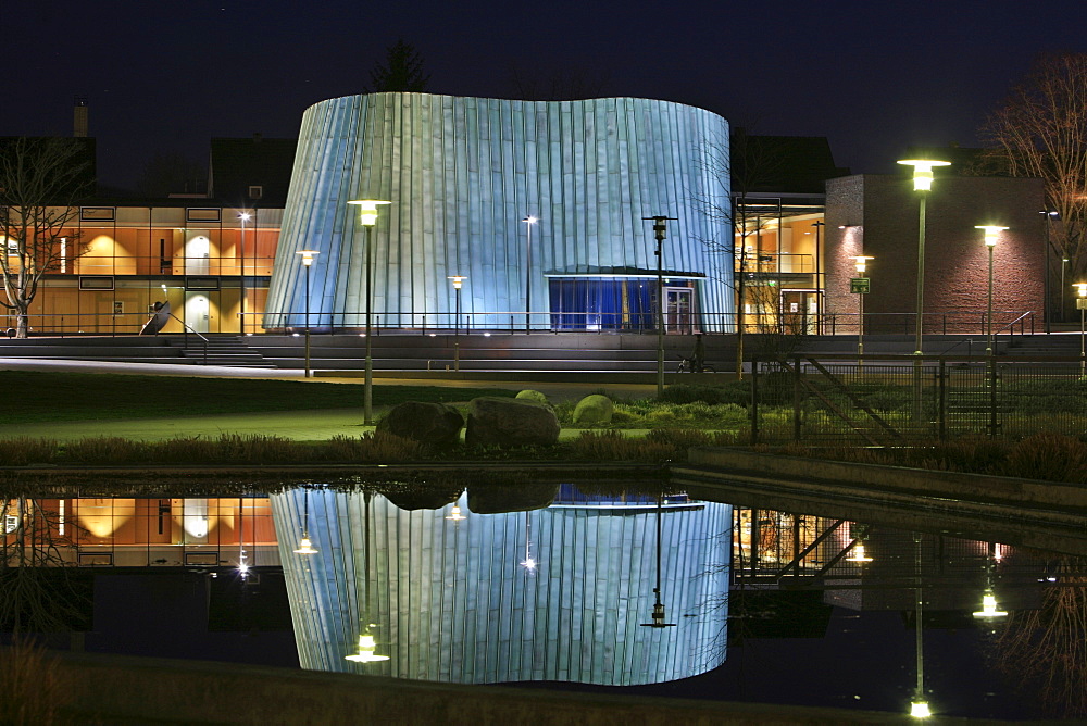 New music school reflected in a pond at dusk, unique architecture, Fellbach, Stuttgart, Baden-Wuerttemberg, Germany