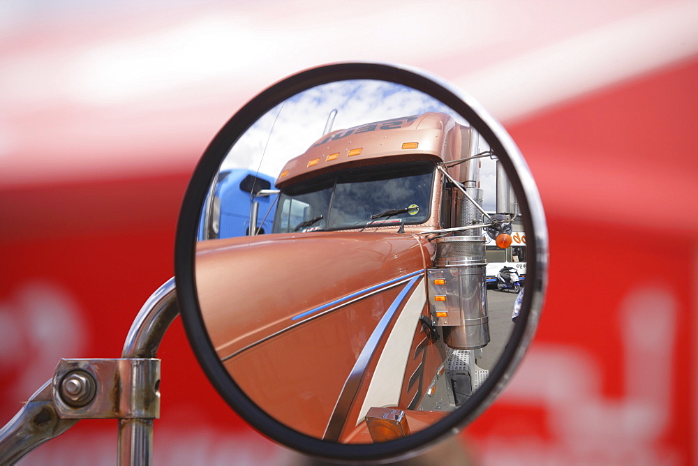 Reflection of a truck in its own rear-view-mirror