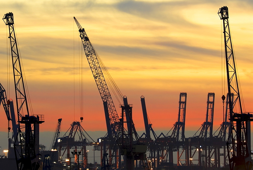 View from the Landungsbruecken Hamburg at sunset, industrial cranes, Hamburg, Germany