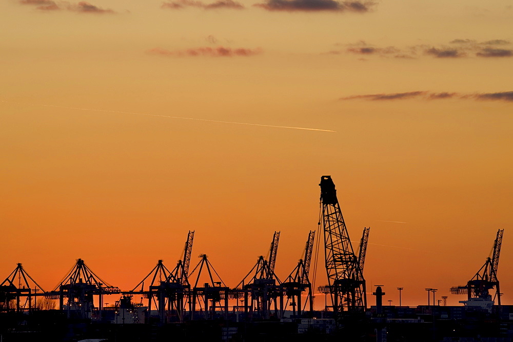 Sunset over the shipping docks in Hamburg, Germany, Europe