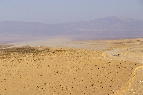 Offroad vehicles are driving through the desert Moroccos