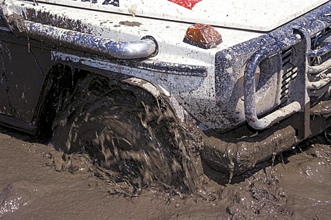 Spinning tyre in mud