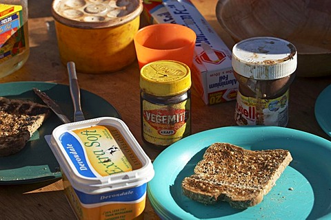 Vegemite, nutella, toast, butter on the breakfast table