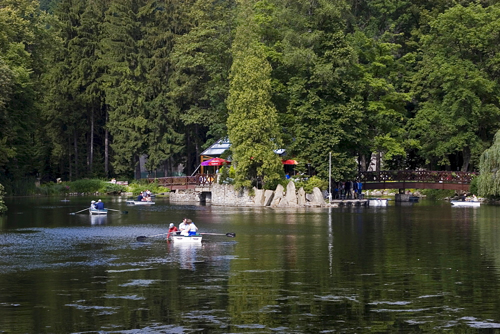 Swan lake in the spa Rajecke Teplice, promenading and rowboats, Slowakei