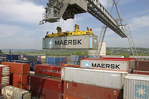 A gantry crane loading nestable containers . Koblenz, Rhineland-Palatinate, Germany