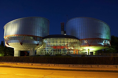 View of the European Court of Justice for human rights with the two cylindrical buildings of the court halls in the evening, Strasbourg, France