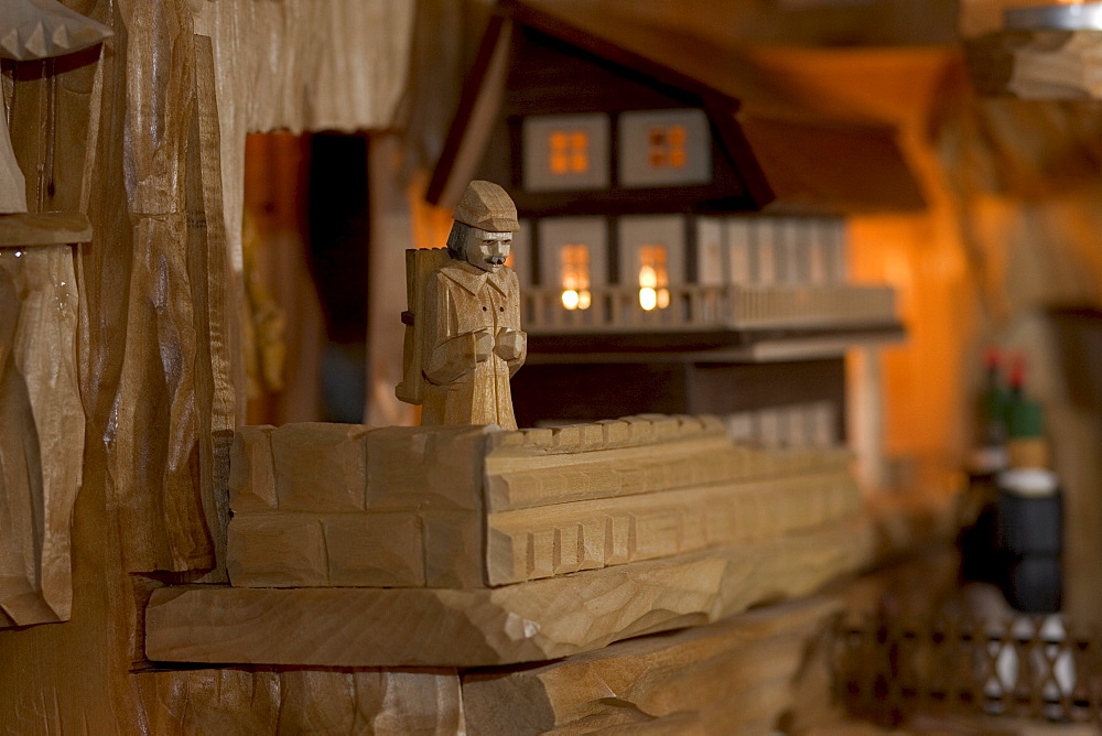 Hand carved miners in a christmas pyramid