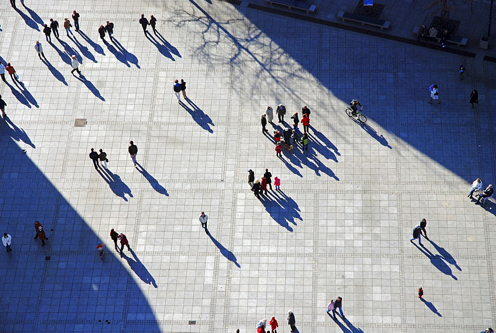 Pedestrians with shadows from the birdÂ¥s view, Ulm, Baden-Wuerttemberg, Germany