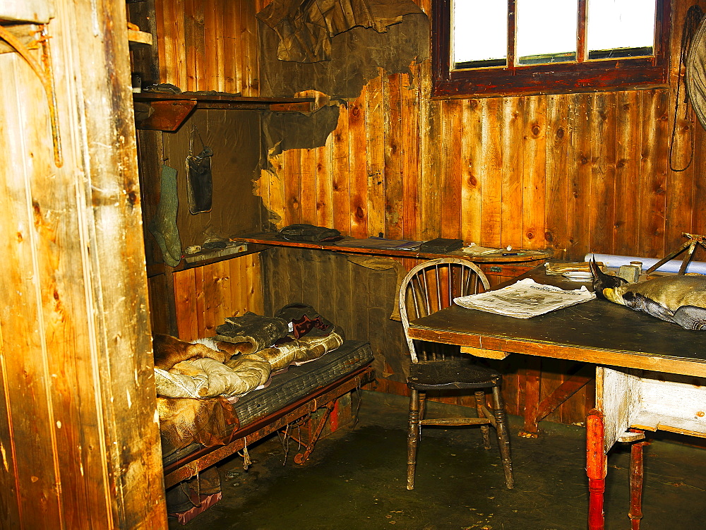 Scott's Hut, interior view, bed with Scott's map table, at Cape Evans on Ross Island, Antarctica