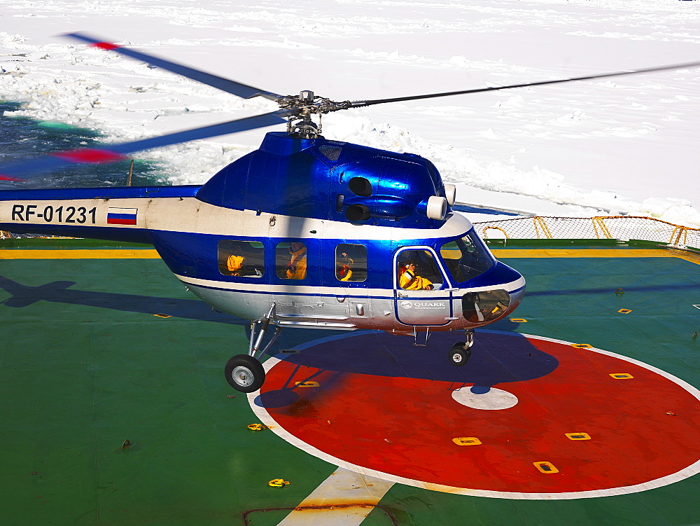 Helicopter landing on the helideck of the Captain Khlebnikov icebreaker, Antarctic