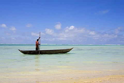 Man in a logboat or dugout boat, Nosy Nato, Madagascar, Africa