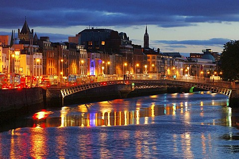 Temple Bar district on the left side of the Liffey River . City view in the dusk . Dublin , Ireland , Europe