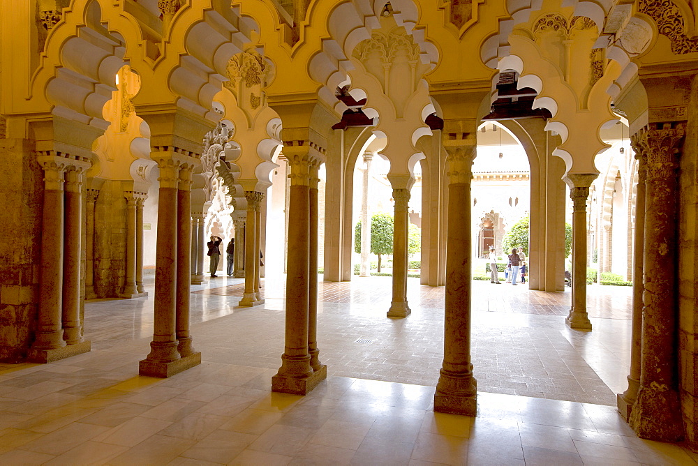 Ornate stone carved arched passageway of the Santa Isabel Patio, Palacio de Aljaferia palace, Moorish architecture, Zaragoza, Saragossa, Aragon, Spain