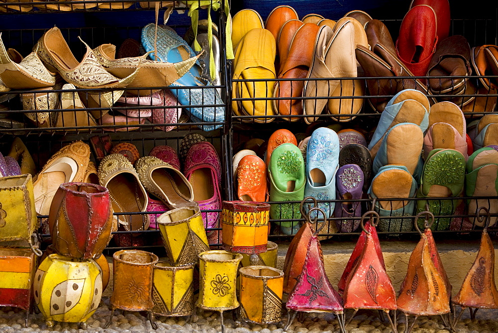 Colourful Moroccan sandals and lamps for sale as souvenirs in Caldereria Nueva Street, Granada, Andalusia, Spain