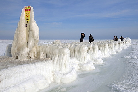 People on icy pier, frozen Black Sea, a rare phenomenon, Odessa, Ukraine, Eastern Europe