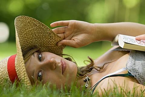 A woman relaxing on the grass