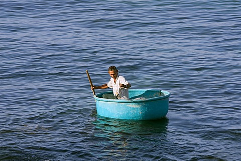 Fisherman in a traditional round boat, Phu Quoc Island, Vietnam, South East Asia, Asia