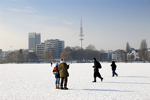 People on the frozen Aussenalster lake in Hamburg, Germany, Europe