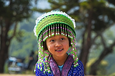 Smiling little girl in a traditional dress, costume, New Year festival, Hmong hill tribe, ethnic minority, Chiang Mai province, northern Thailand, Thailand, Asia