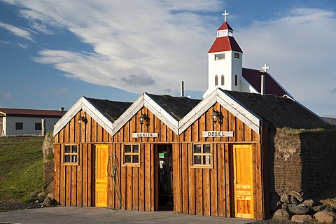 The church and a petrol station in a wooden hut, Moeâˆšâˆžrudalur, Highlands of Iceland, Iceland, Europe