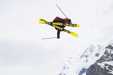 Trick skier jumping, in front of Eiger Mountain, MâˆšÂºrren, Bernese Oberland, Canton of Bern, Switzerland