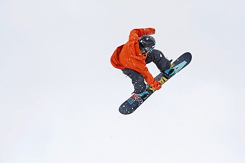 Trick skier jumping, in front of Eiger Mountain, MâˆšÂºrren, Bernese Oberland, Canton of Bern, Switzerland