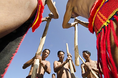 Members of the Samdom tribe show their traditional way of crushing crops at the annual Hornbill Festival, Kohima, Nagaland, India, Asia