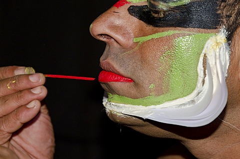 The make-up of the Kathakali character Jayantha is being applied, Varkala, Kerala, India, Asia