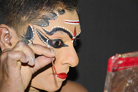 The make-up of the Kathakali character Nakrathundi is being applied, Varkala, Kerala, India, Asia