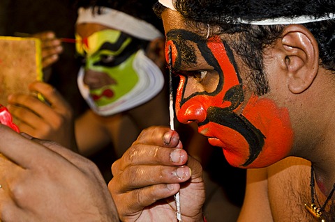 The make-up of the Kathakali character Bali is being applied, Perattil, Kerala, India, Asia