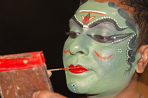 The make-up of the Kathakali character Kathalastri is being applied, Perattil, Kerala, India, Asia